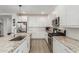 Bright kitchen featuring granite countertops, stainless steel appliances, and white cabinets at 12344 E Soloman Rd, Gold Canyon, AZ 85118