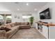 Inviting living room with a comfortable sectional sofa, TV, and stylish decor at 12344 E Soloman Rd, Gold Canyon, AZ 85118