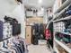 Walk-in closet filled with storage shelves and hanging clothes at 12344 E Soloman Rd, Gold Canyon, AZ 85118