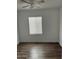 Bedroom features wood floors, a window with blinds, and neutral walls at 12814 N 19Th Pl # 19, Phoenix, AZ 85022