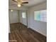 Comfortable bedroom showcasing a large closet with mirrored doors and a ceiling fan at 12814 N 19Th Pl # 19, Phoenix, AZ 85022