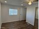 Inviting bedroom featuring new wood-look floors, a closet and new neutral paint at 12814 N 19Th Pl # 19, Phoenix, AZ 85022