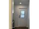 Interior door with glass inset window and black hardware at 12814 N 19Th Pl # 19, Phoenix, AZ 85022
