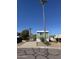 Charming exterior of a one-story home with a carport, easy access parking, and green accents at 12814 N 19Th Pl # 19, Phoenix, AZ 85022