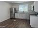 Well-lit kitchen boasting granite countertops and stainless steel refrigerator at 12814 N 19Th Pl # 19, Phoenix, AZ 85022