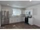 Modern kitchen with stainless steel appliances, granite countertops, and ample cabinet space at 12814 N 19Th Pl # 19, Phoenix, AZ 85022