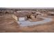 A high angle view of a single Gathering home with two car garage and gravel driveway at 12942 S 218Th Ave, Buckeye, AZ 85326