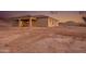 Desert home featuring a covered patio and lovely mountain views at 12942 S 218Th Ave, Buckeye, AZ 85326