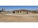 Beautiful exterior of desert home with attached garage, gravel driveway and view at 12942 S 218Th Ave, Buckeye, AZ 85326