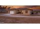 Inviting home featuring a neutral stucco exterior, tile roof, and attached two-car garage at 12942 S 218Th Ave, Buckeye, AZ 85326