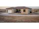 Charming home features a neutral color palette, tile roof and a well lit two car garage at 12942 S 218Th Ave, Buckeye, AZ 85326
