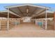 Well-maintained horse barn with multiple stalls and metal roof, providing shelter for livestock at 1307 E Galvin St, Phoenix, AZ 85086