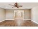 Inviting living room featuring a ceiling fan and beautiful flooring, creating a warm and welcoming atmosphere at 1307 E Galvin St, Phoenix, AZ 85086