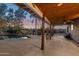 Expansive covered patio with a beautiful pool and lush landscaping provides a serene outdoor retreat at 1307 E Galvin St, Phoenix, AZ 85086