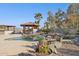 Beautiful backyard pool with a bar, rock features, and desert landscaping under a blue sky at 1307 E Galvin St, Phoenix, AZ 85086