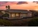 Rear exterior featuring covered patio, desert landscaping, and tile roof at 14218 W Via Tercero --, Sun City West, AZ 85375