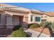 Inviting single-story home with lush landscaping, neutral paint, tile roof, and covered front entryway at 14218 W Via Tercero --, Sun City West, AZ 85375