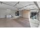 Bright garage with epoxy flooring, built-in cabinets, laundry area with washer, dryer, utility sink, and water heater at 14218 W Via Tercero --, Sun City West, AZ 85375