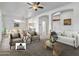 Stylishly staged living area with contemporary furnishings, open layout, and kitchen access, great for gatherings at 14218 W Via Tercero --, Sun City West, AZ 85375