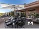 Outdoor patio with shaded dining and lounge area, ideal for entertaining guests at 14218 W Via Tercero --, Sun City West, AZ 85375