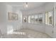 Bright sitting room with tile flooring, white walls, and multiple windows allowing for natural light to enter the room at 14218 W Via Tercero --, Sun City West, AZ 85375