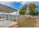 Fenced backyard with mature landscaping, covered patio, and sparkling private pool beyond the fencing at 14436 N 34Th Pl, Phoenix, AZ 85032