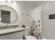 Nicely updated bathroom with granite counters, stylish fixtures, and tub with shower at 14436 N 34Th Pl, Phoenix, AZ 85032