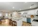 Open kitchen with granite countertops, a breakfast bar, white cabinets, and stainless steel appliances at 14436 N 34Th Pl, Phoenix, AZ 85032