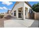 A spacious backyard featuring a concrete patio and stucco wall, perfect for outdoor enjoyment at 14610 N 87Th Ave, Peoria, AZ 85381