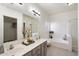 Bright bathroom features double sinks, garden tub, and walk-in shower at 14610 N 87Th Ave, Peoria, AZ 85381