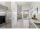 Bright kitchen featuring stainless steel appliances, tile flooring, and access to the backyard at 14610 N 87Th Ave, Peoria, AZ 85381