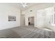 Open floor plan with plush carpeting, vaulted ceilings, and great natural light at 14610 N 87Th Ave, Peoria, AZ 85381