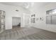 Spacious living room showcasing plush carpeting, vaulted ceilings, and plenty of natural light at 14610 N 87Th Ave, Peoria, AZ 85381