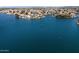 An expansive aerial shot showcasing luxury waterfront homes on a picturesque lake at 14610 N 87Th Ave, Peoria, AZ 85381