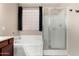 Bathroom featuring a soaking tub with tiled surround and a glass-enclosed shower at 14846 N 145Th Ave, Surprise, AZ 85379