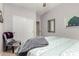 Neutral bedroom featuring carpet, decor art, and a comfortable chair with blanket at 14846 N 145Th Ave, Surprise, AZ 85379