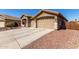 Charming single story home with a two car garage and well maintained desert landscaping at 14846 N 145Th Ave, Surprise, AZ 85379