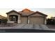 Charming single-Gathering home featuring a three-car garage and a well-maintained front yard at 14846 N 145Th Ave, Surprise, AZ 85379