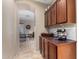 Hallway with built-in storage and wine rack, leading to the dining room at 14846 N 145Th Ave, Surprise, AZ 85379