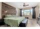 Serene main bedroom featuring a wooden headboard, cozy bedding, and a view to the exterior at 14846 N 145Th Ave, Surprise, AZ 85379