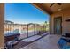 View from the covered patio of pool with lush landscaping, fencing, and yard at 14846 N 145Th Ave, Surprise, AZ 85379