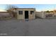 Property features a small shed structure with a neutral exterior, possibly for storage or a workshop at 150 N 65Th St, Mesa, AZ 85205