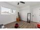 Cozy room with great natural light and closet space, with a cool-toned ceiling fan at 15028 N 35Th Ave, Phoenix, AZ 85053