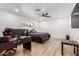 Spacious bedroom featuring wood-look floors, a ceiling fan and a bright window at 15028 N 35Th Ave, Phoenix, AZ 85053