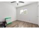 A blank canvas room for creativity, with a ceiling fan and window providing natural light at 15028 N 35Th Ave, Phoenix, AZ 85053
