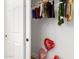 An interior view of an organized closet, with clothes hanging on racks and personal items on the floor at 15028 N 35Th Ave, Phoenix, AZ 85053