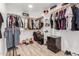 Spacious walk-in closet with custom shelving and ample storage space for clothes and accessories at 15028 N 35Th Ave, Phoenix, AZ 85053