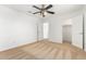 Bright bedroom featuring neutral carpet, a ceiling fan, and a closet at 16189 N 137Th Dr, Surprise, AZ 85374