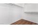 Walk-in closet with laminate floors and rod iron for plenty of storage space at 16189 N 137Th Dr, Surprise, AZ 85374