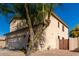 Exterior elevation of home's back side with block wall and desert landscaping at 16189 N 137Th Dr, Surprise, AZ 85374